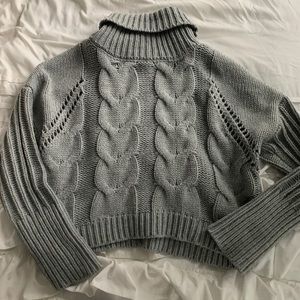 Cropped cable knit sweater